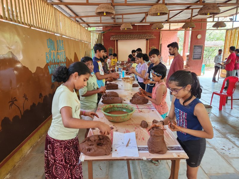 Kids performing with handmade masks