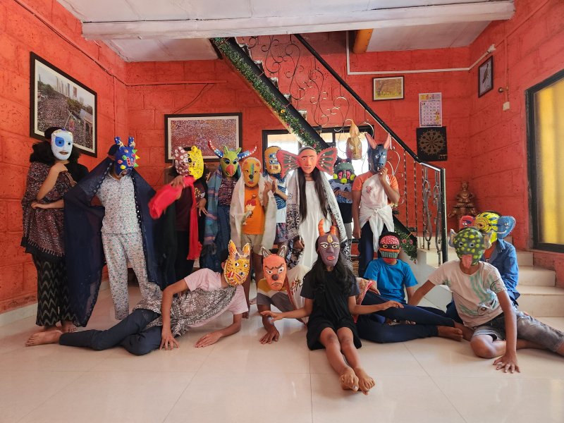 Children creating masks during Iblis workshop